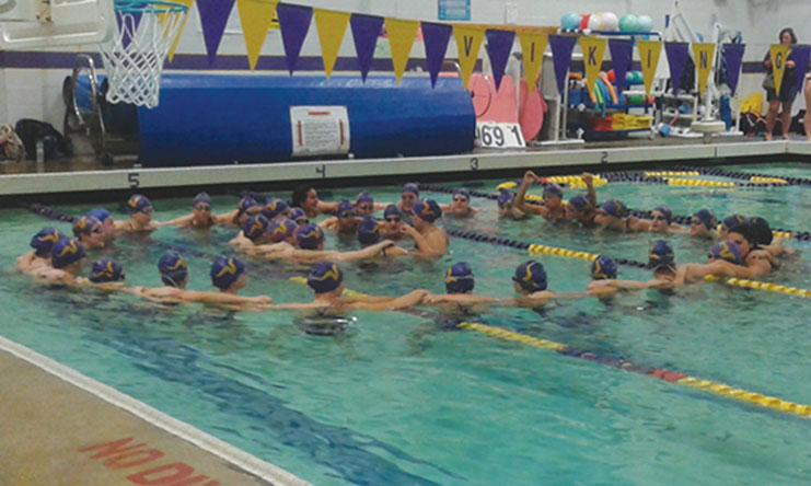Group dynamic: Viking Girls Swim Team group together to start off their before game chant. The team won 137 to 48 which more than doubled Cascade’s score. They were overjoyed to see all the fans there at this Game of the Week on October 15. “All the swimmers were like 'we have fans.' It was really cool to see everyone there,” junior Sydnie Chesley said.
