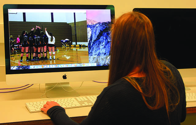 
Workplace Technology: Senior Amanda Mirante edits a picture of the LSHS Varsity Volleyball team on an iMac in her Yearbook class. Mirante joined the Yearbook class as a sophomore and experienced the change from Microsoft PCs to iMacs. “The technology of the computers is amazing. We are all slowly learning how to use it, but we appreciate the update,” Mirante said.