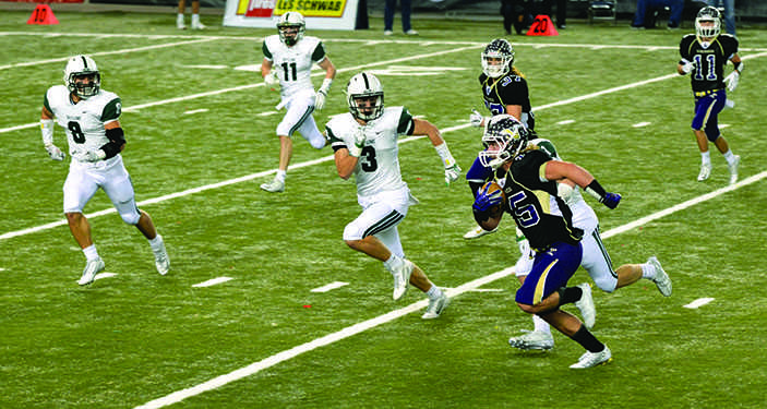 Senior wide receiver Riley Krenz barrels towards the end zone before getting tackled near the 20 yard line in the first quarter. Despite ending their last high school season Saturday night the seniors on the team put a very positive spin on their loss. “It definitely was a terrible feeling knowing it was going to be the last time but as the days go on you have to look back and look at the good that you did and the good undefeated season,” Krenz said. 