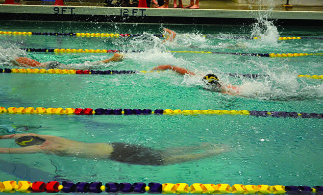 Boy’s swim competes in a home meet on January 14. The team continued its momentum from the prior weekends invitational. “The team is ahead of schedule from where we were last year at the same time with 5 people qualified for state after the weekend,” junior Carter Walles said. 
