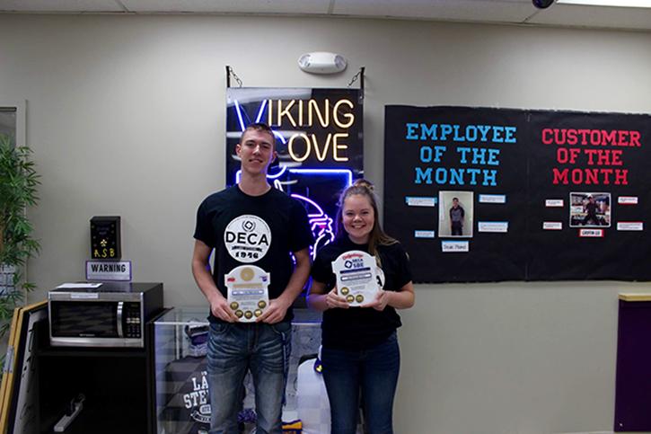 Senior Braden Ash and Junior Britney Watson celebrate the gold-level certification for the Lake Stevens High School Cove. This gives the Cove distinction in being one of the highest quality business operations in the nation. "Completing the SBE project is a significant reward for their hard work and have the Cove recognized as a distinguished student enterprise," said DECA Advisor Karen Morton.
