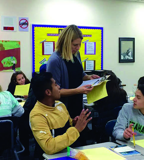 New English teacher, Annemarie Russell, delegates 4th period English during book sign-ups.