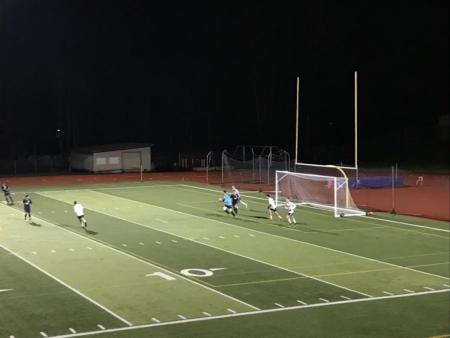 Goalie Jameson Smith catches ball before Kamiak is able to score.