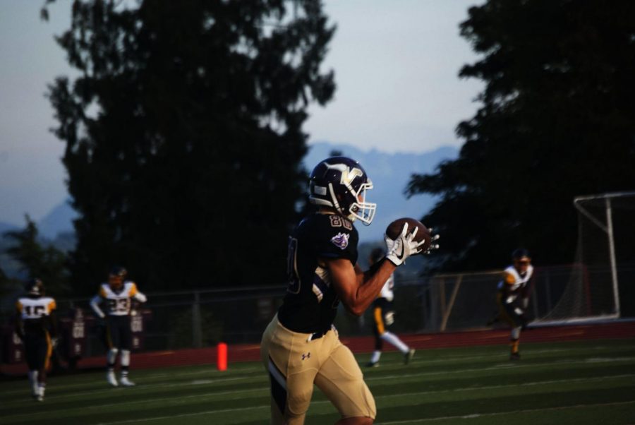 Junior Brendan Ascher catches a pass during pregame warmups before their matchup against Mariner. The Vikings beat the Marauders 14-3. Ascher is one of many new wide receivers for Lake Stevens.