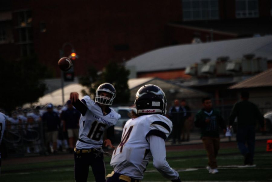 Freshman quarterback Tanner Jellison throws a pass to sophomore Skyler Reyna during pregame warmups before their matchup against Mount Vernon. The Vikings won the game 72-14. Reyna had 2 carries for 19 yards and 2 touchdowns in his first varsity appearance.