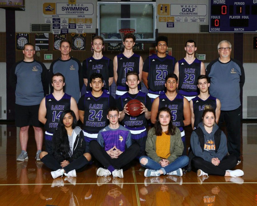 Prepared for the Holidays: The Lake Stevens boys basketball team gets their team picture taken before a game earlier this season. The Vikings finished 4th place in the Surf n' Slam holiday tournament. Senior Ryder Kavanaugh (holding the ball) led the way with 87 points in 3 games.
