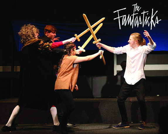 TOUCHÉ: Seniors Joshua Day, Luke Joss, Julia Pinheiro, and sophomore Ryan Van der Put play out the fight scene during dress rehearsal. The cast became really close due to the small number of characters in the show. Its hard to replicate a relationship like that into words; theres such a natural tight bond and they basically become your second-hand family, Van der Put said.