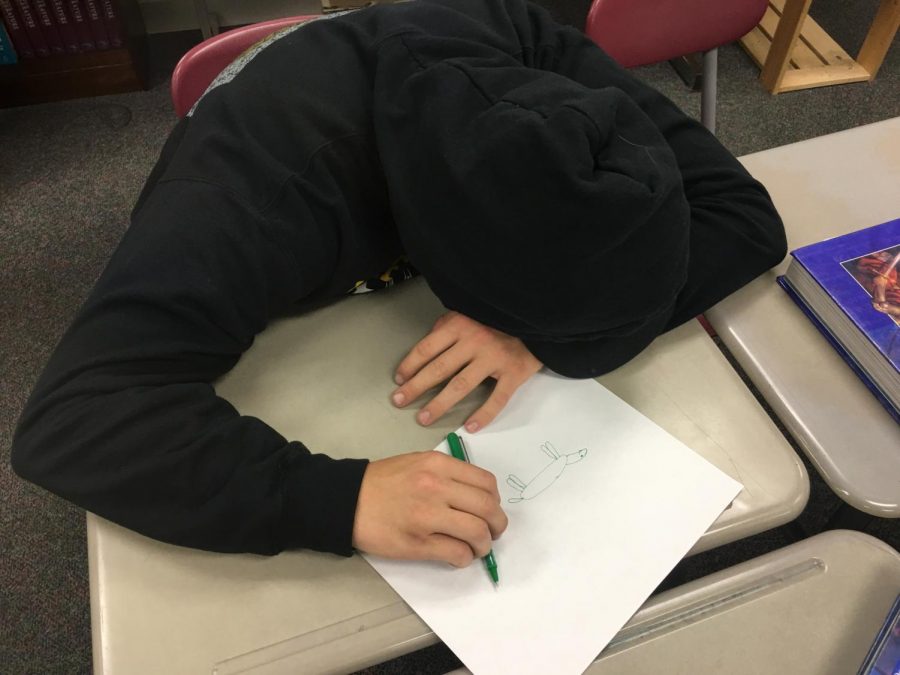 LSHS senior suffers from the late stages of senioritis. The coffee has worn off and has left the student helpless, unable to find motivation in his final days of high school. 
