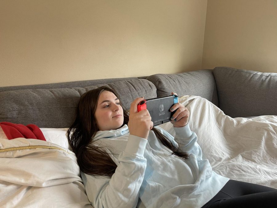 Tranquil Gamer: Senior Brenda Call plays relaxing video games on her Nintendo Switch. She worked all day in distance learning and attended classes on google meet. “I’m really grateful that I am able to relax after a stressful day of school work,” Call said.
