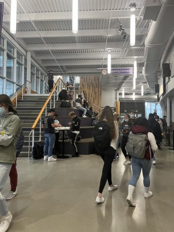 As students are stroll the halls during lunch, they get to enjoy the Learning Stairs to eat and hang out. To the right, you see The Cove, where an array of food, drinks and more are available to purchase.
