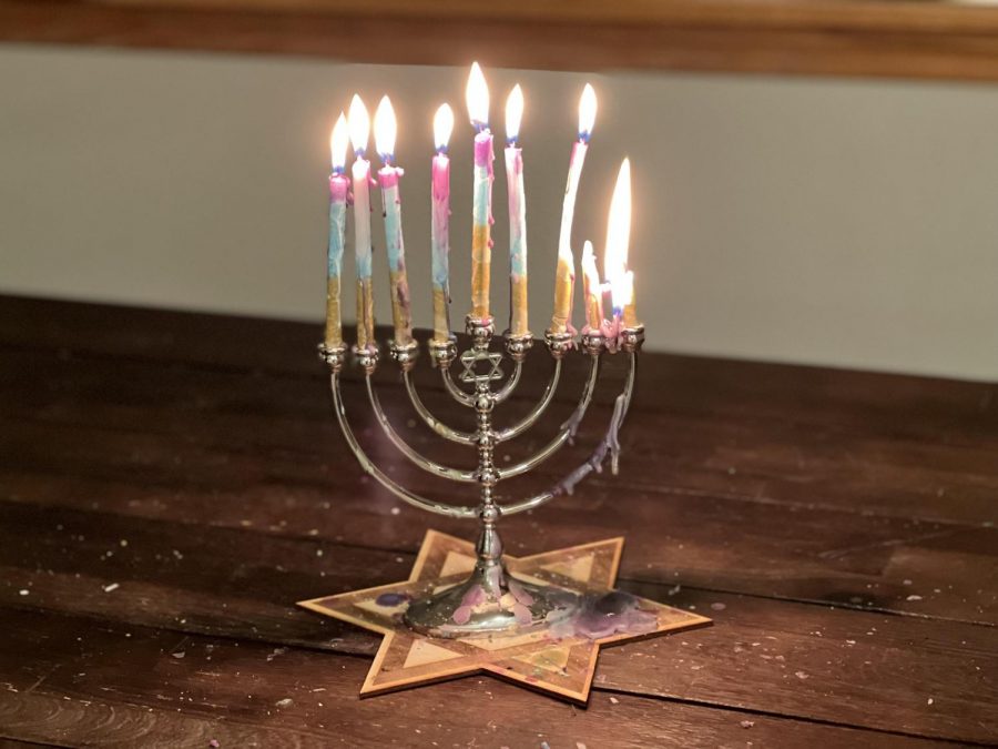 Holiday Beginnings: The menorah is fully lit for the eighth and final day of Hannukah. The menorah commemorated the Second Temple in Jerusalem. "It means good company, well being, eating good food, gifts, and gratefulness," Ethan Tran said.