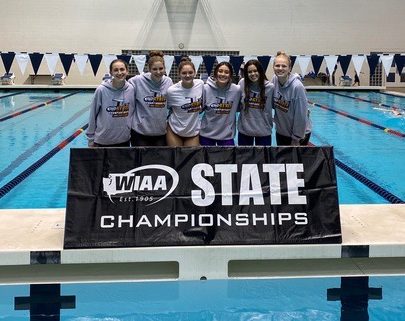 State action: The six swimmers on the girls swim team that made it to state this season stand smiling at the camera. Pictured left to right, Sarah Fleischmann, Autumn Marlatt, Mackenzie Smith, Charlotte Lamb, Savannah Foley, and Madelynn Butler. They also reminded us about like the situation and stuff and like every, every day that went by going to practice without a COVID case was something to like look forward to next day, you know, sophomore Charlotte Lamb said.