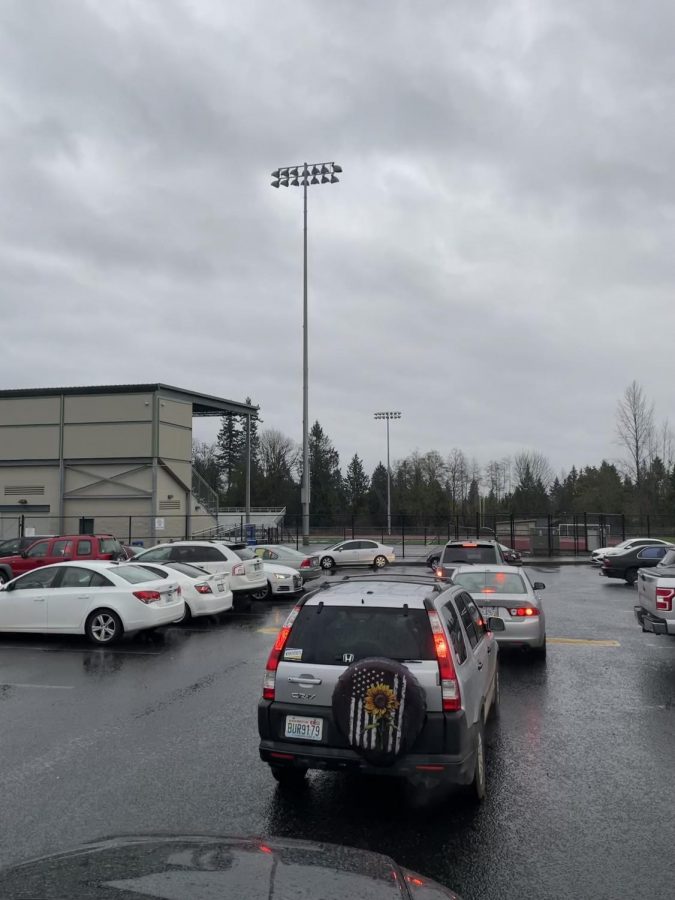 After dismissal: Vehicles belonging to students file from multiple directions as they leave school. Construction has downsized the parking lot since the buildings renovations. 
It can take up to fifteen minutes or longer to leave after a long school day, senior Ashlynn Wright.