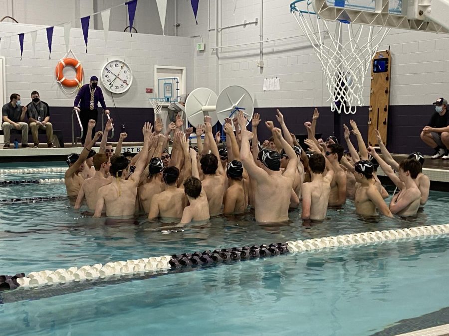 Pumped up: The Boys Swim and Dive team excitedly yell the cheer they do before every meet. Swimmers created cheers for the divers that they chant after each dive. Things like, Honey, wheres my super suit? or...C-4. Hit! you sunk my battleship! for each diver makes it fun. I know the divers love hearing them, and the swimmers love making them up. Its fun to watch other schools react too. We have probably the most enthusiastic diver cheers in the area! Coach Brady Dykgraaf said.