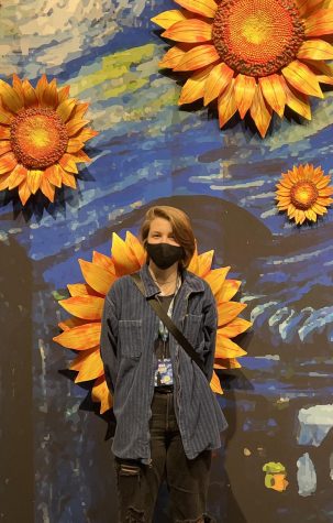 Blossoming Growth: Junior Gabrielle Dacar stands in front of sunflowers at the exhibition entrance. The Van Gogh Experience is a 360° immersive exhibition of the artist’s work and lifetime to show it to a new audience in a new light. “Bringing to life the culture and how people visualize things, it’s very important. It brings in individualism and just a new way of viewing aspects of life,” senior Lillianne Head said.
