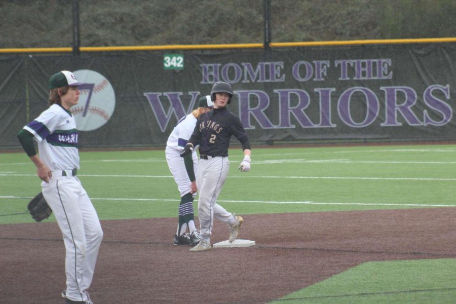 Rained+out%3A+Tiernan+Perkins+runs+to+second+base+in+the+pouring+rain+during+a+hard+game.+Perkins+has+been+excited+to+play+his+junior+year+but+has+faced+unexpected+weather+that+has+postponed+games.+You+never+know+when+your+last+day+will+be%2C+so+work+hard+and+make+today+better+than+yesterday%2C+Perkins+said.