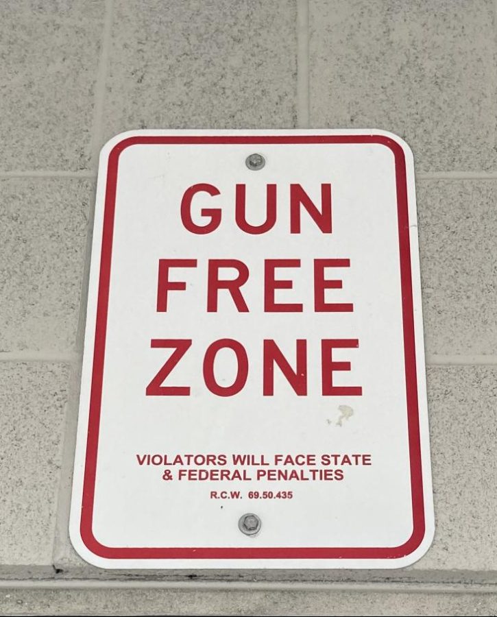 School Safety: Signs like the one above inform everyone that guns are not allowed on school campuses. Despite this, school shootings have become a devastatingly common occurrence. “Guns have evolved over the years. So should our gun laws,” activist Shane Claiborne said. 
