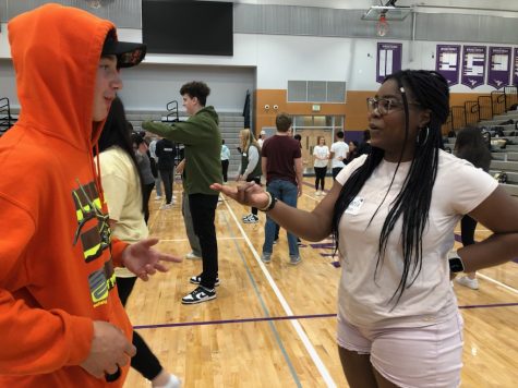 Making connections: Sophomore Daymen Schmuck and junior Miracle Ohiri share a conversation after being paired for an activity. Students worked in pairs for short activities, as well as groups of eight for longer games. “Youre a Viking, and Im a Viking, so we already have one thing in common,” Principal Leslie Ivelia said.