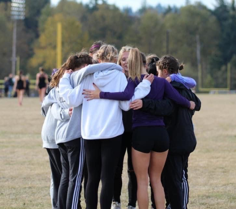 Lake Stevens Girls Cross Country takes WESCO and is on their way to state! The Lake seniors coming together for one last huddle.