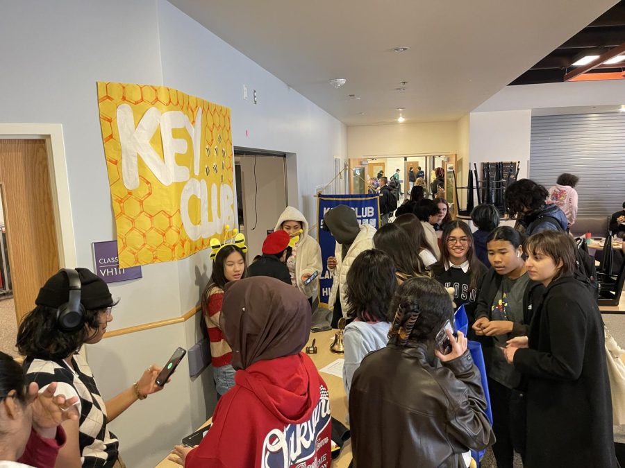 Promoting: Key Club members attend a booth at the LSHS club fair. Here, clubs set up booths to advertise their clubs to students.