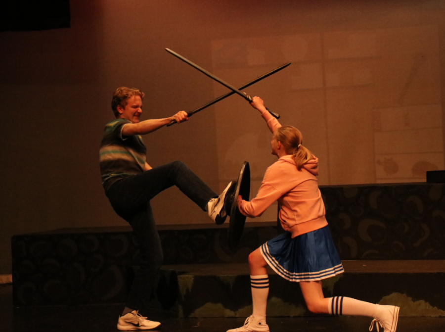 Break a leg: Junior Alexander Kleparek and senior Katy Menzel clash swords in preparation for the opening night of She Kills Monsters on April 20. The cast and crew worked hard on the production to deliver their best work.