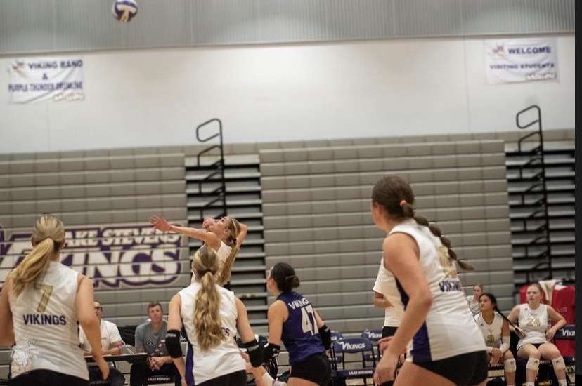 Sophomore Laura Eichert hits the ball at the opposing team, surrounded by teammates, seniors Lindsay Lindbloom, Katelyn Eichert and Alyss Kelly and junior Mia Turner.
