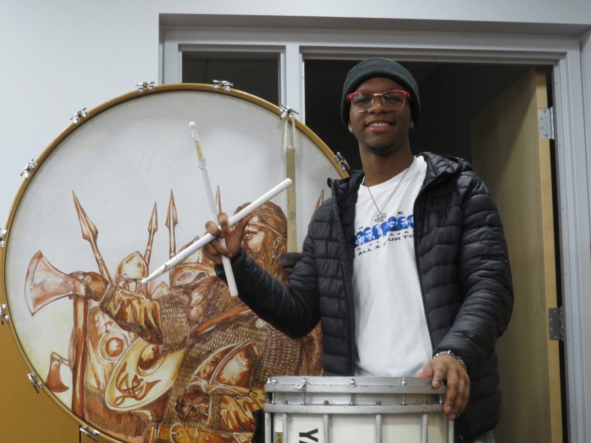 Dahmonni Allen plays his drum after Wind Ensemble.