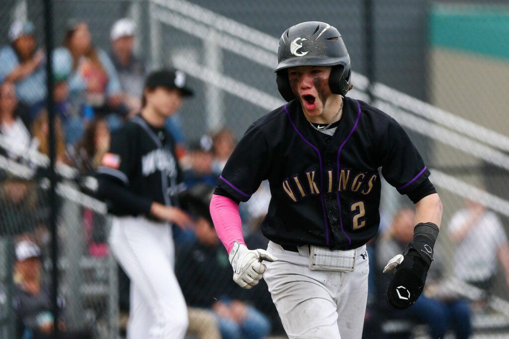 Junior Aspen Alexander celebrates as he gets the game-tying run in win over Jackson during the 2023 season.