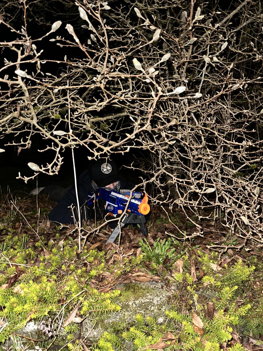 Senior Haydan Villasenor camps out inside of the bushes waiting to take his shot on his target.