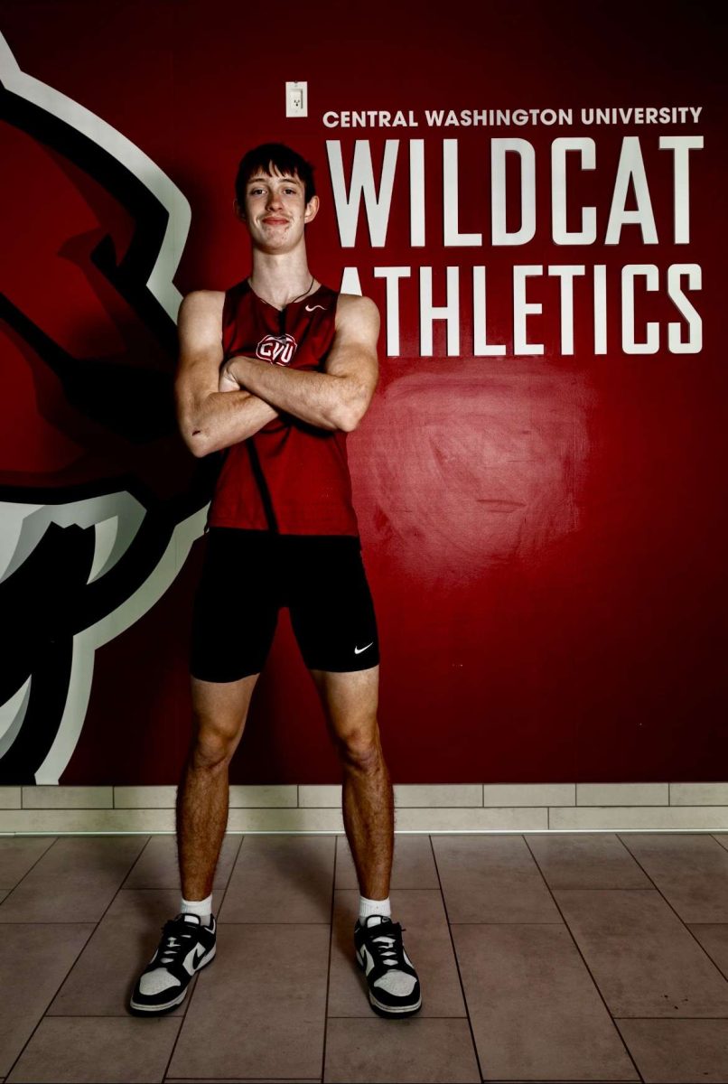 Central focus: LSHS senior David "Boogy" Brown shows off his new threads in front of the Central Washington University Athletics mural after committing to the Wildcats on January 30, 2024.