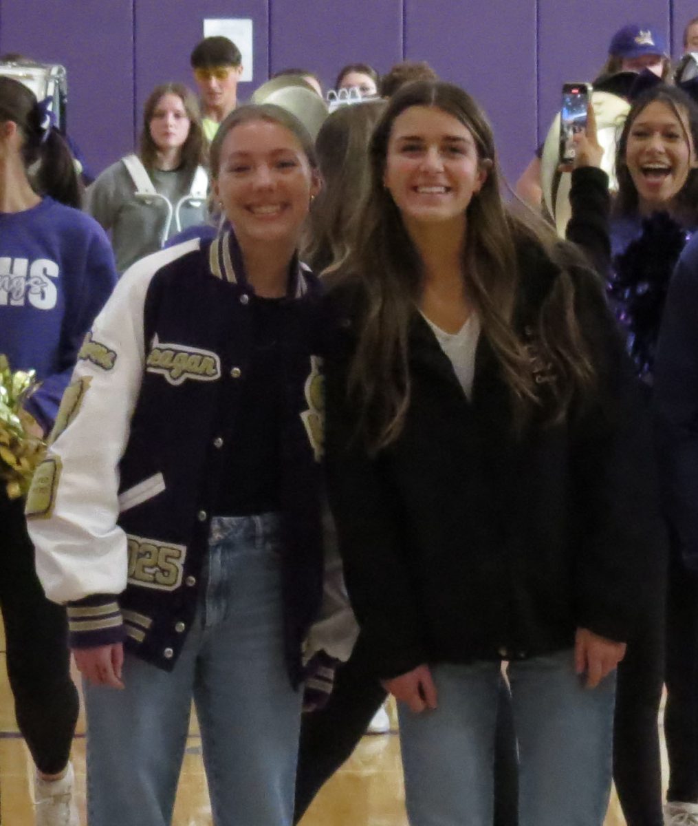 Reagan Rich and Hallie Carroll pose for a photo together at the Girls Cross Country state send off.