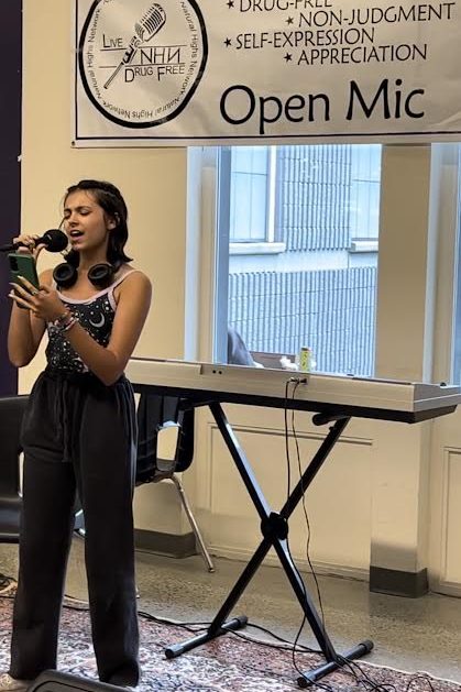 Sophomore Jazmyn "Zero" Smith sings during an Open Mic session during Friday lunch.