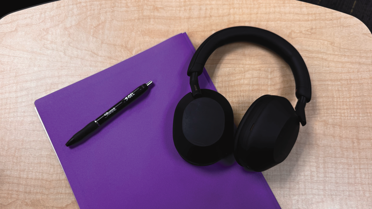 A picture of an LSHS student's headphones, pen, and schoolwork folder.