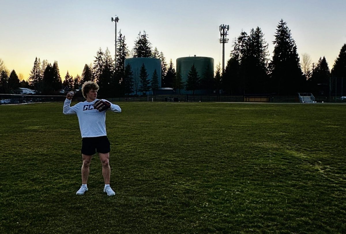 Senior baseball captains Aspen Alexander and A'Alona De Martin play catch during captain-led practices before tryouts.