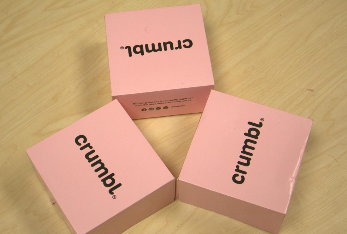 Crumbl packages their delicious cookies in their iconic pink boxes.