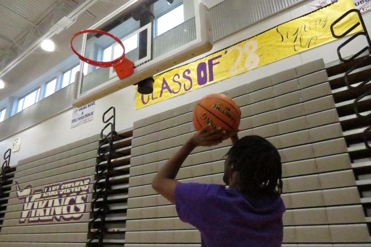Senior Daniel Ngezaho shoots reps.