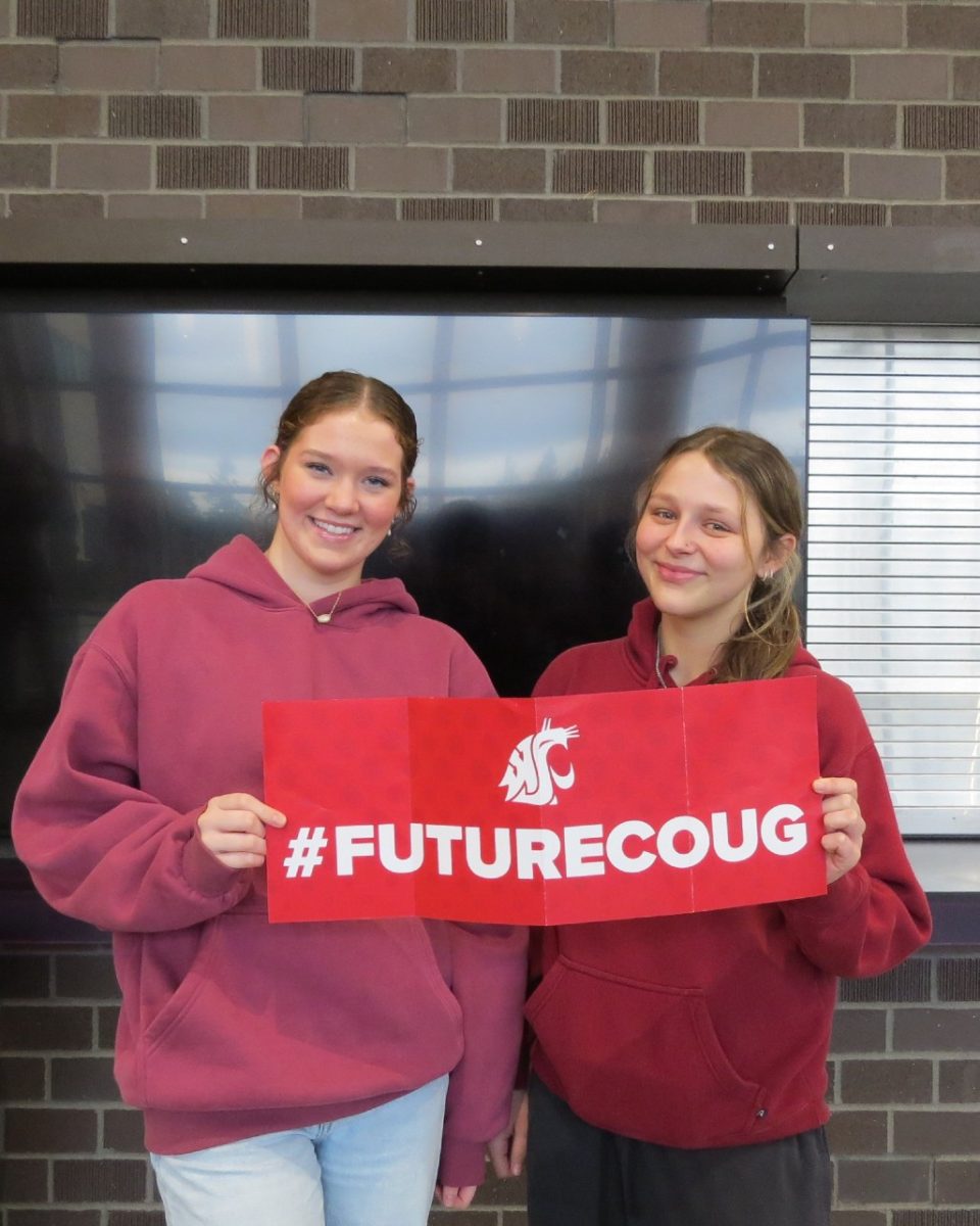 Seniors Autumn Norgaard and Hannah Keith proudly show off their plan to attend WSU next school year.