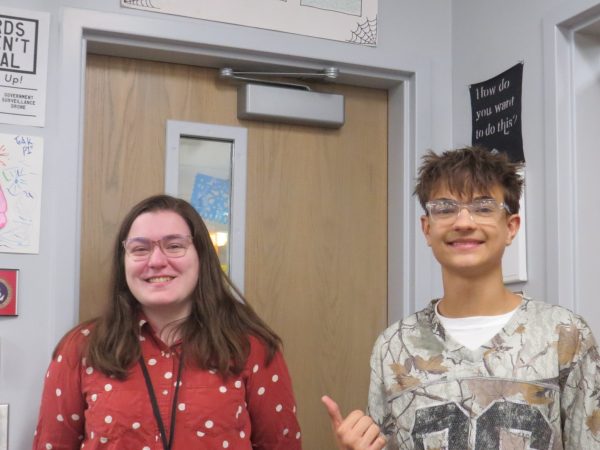 Junior Connor Berbells (right) smiles at the sight of substitute teacher Julia Brigolin as she covers for Trevor Wood's class (left).