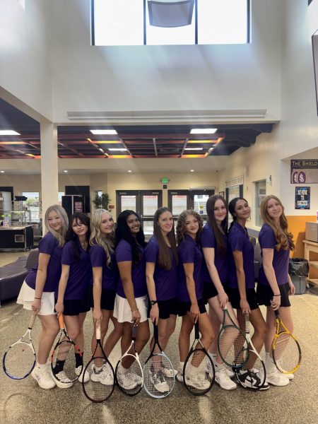 Lake Stevens High School Girls Varsity Tennis team poses for a photo dressed in uniform.