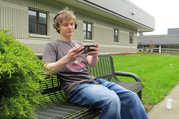 Lake Stevens senior Liam Standridge listens to music while playing a game on his Nintendo console.